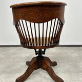 Swivel office chair in oak with a rattan seat.