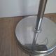 Vintage chrome metal floor ashtray with integrated tray.