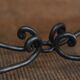 Table basse metal perforé pied fer forgé 1940