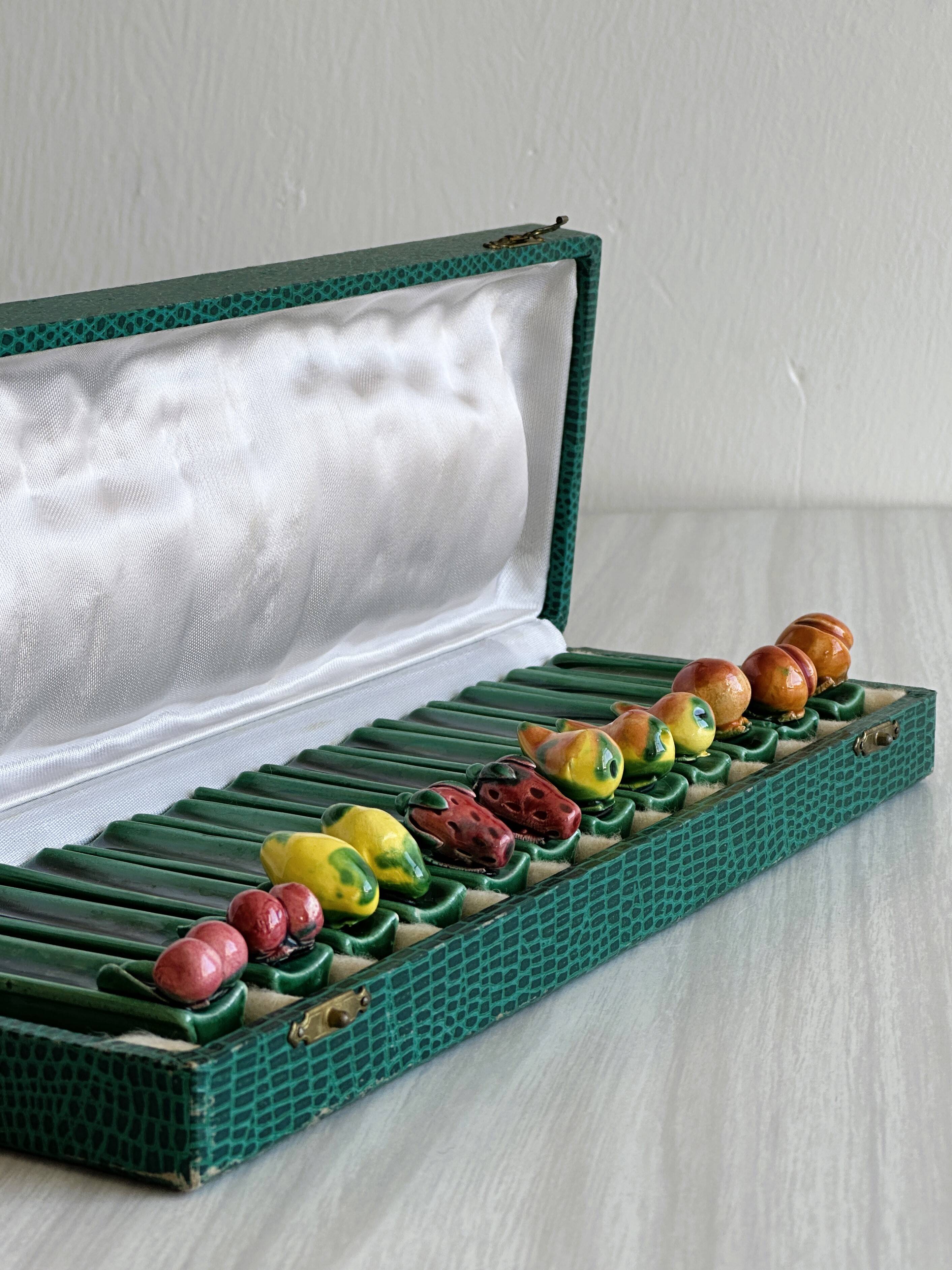 12 ceramic fruit knife holders.