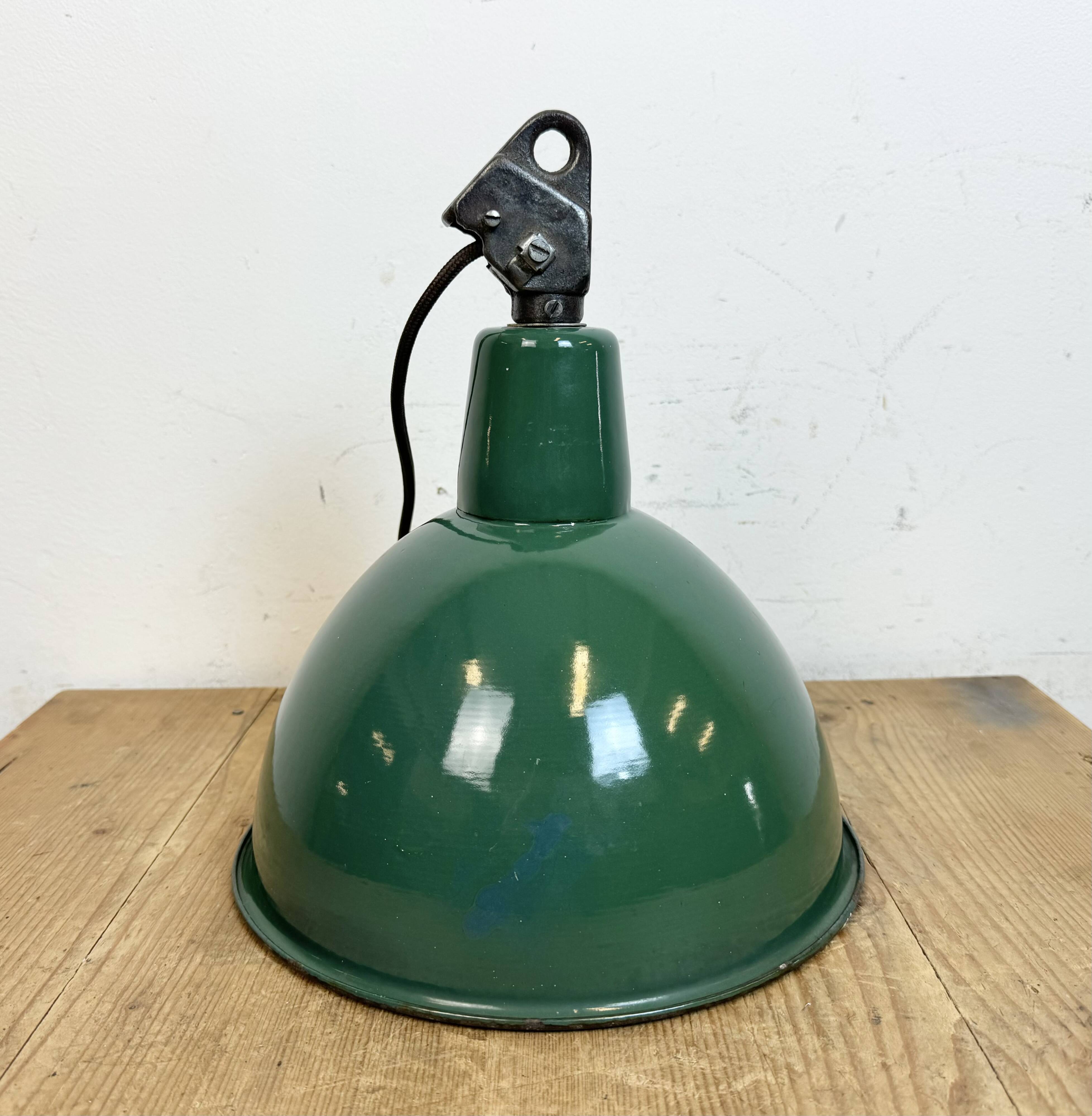 Industrial green enamel factory lamp with cast iron top, 1960s