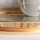 Fruit-shaped liqueur service in porcelain or tea set with its mirror tray.