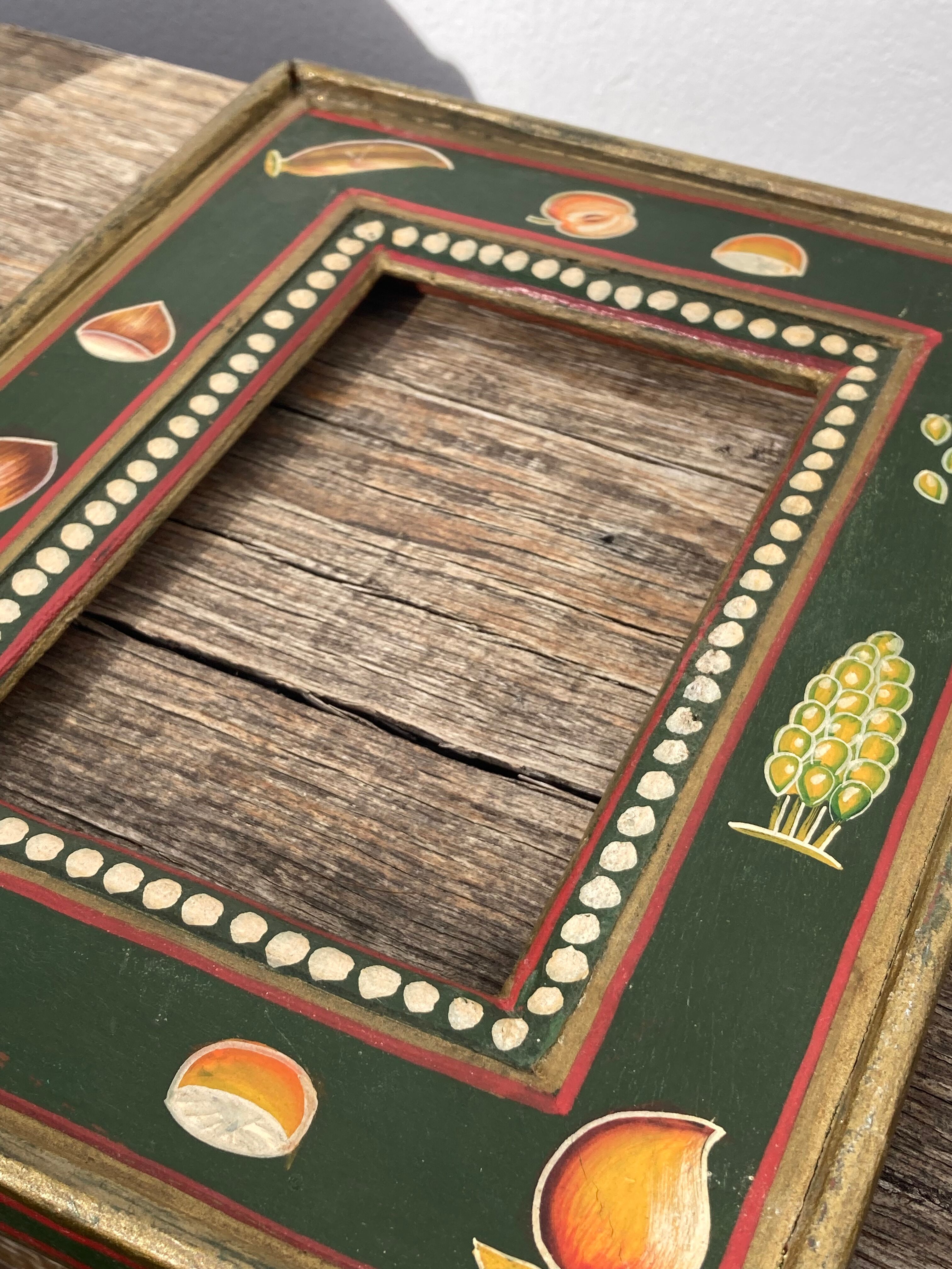 Hand-painted wooden frame with fruit decoration