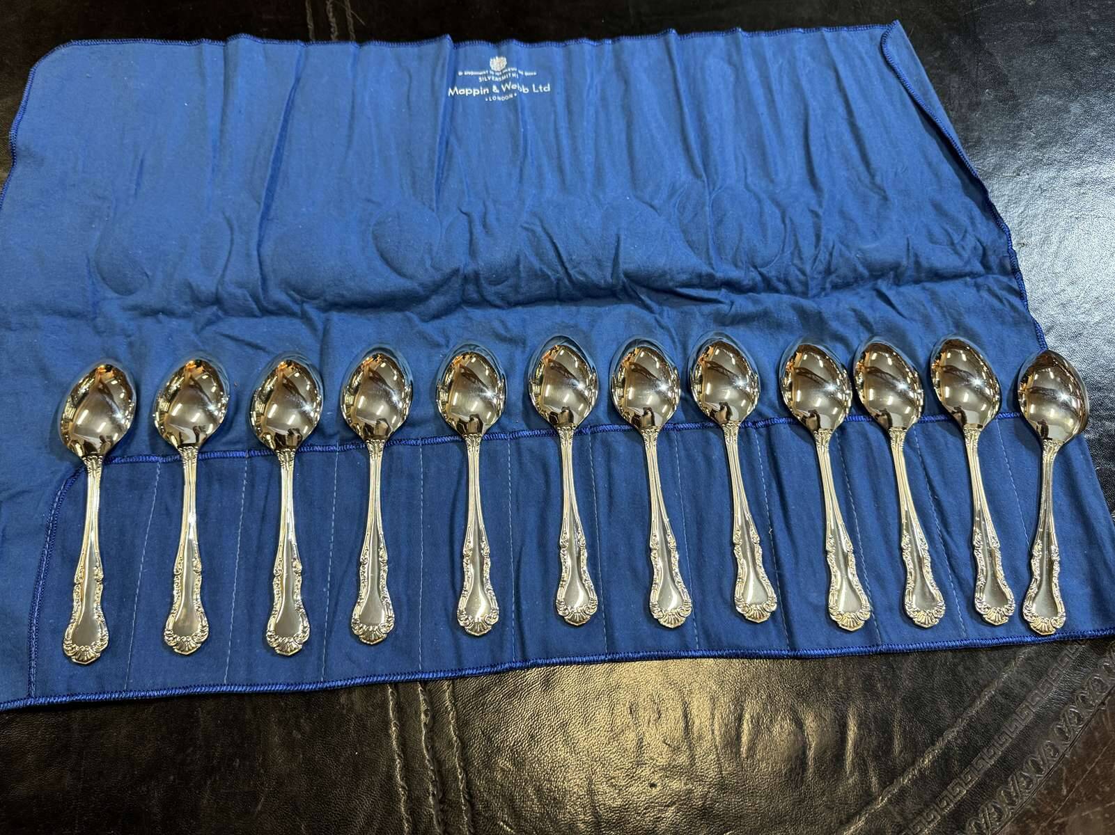 Set of 12 dessert spoons by Mappin and Webb in silver plate.