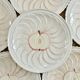 Vintage earthenware plates with a trompe l'oeil apple tart design