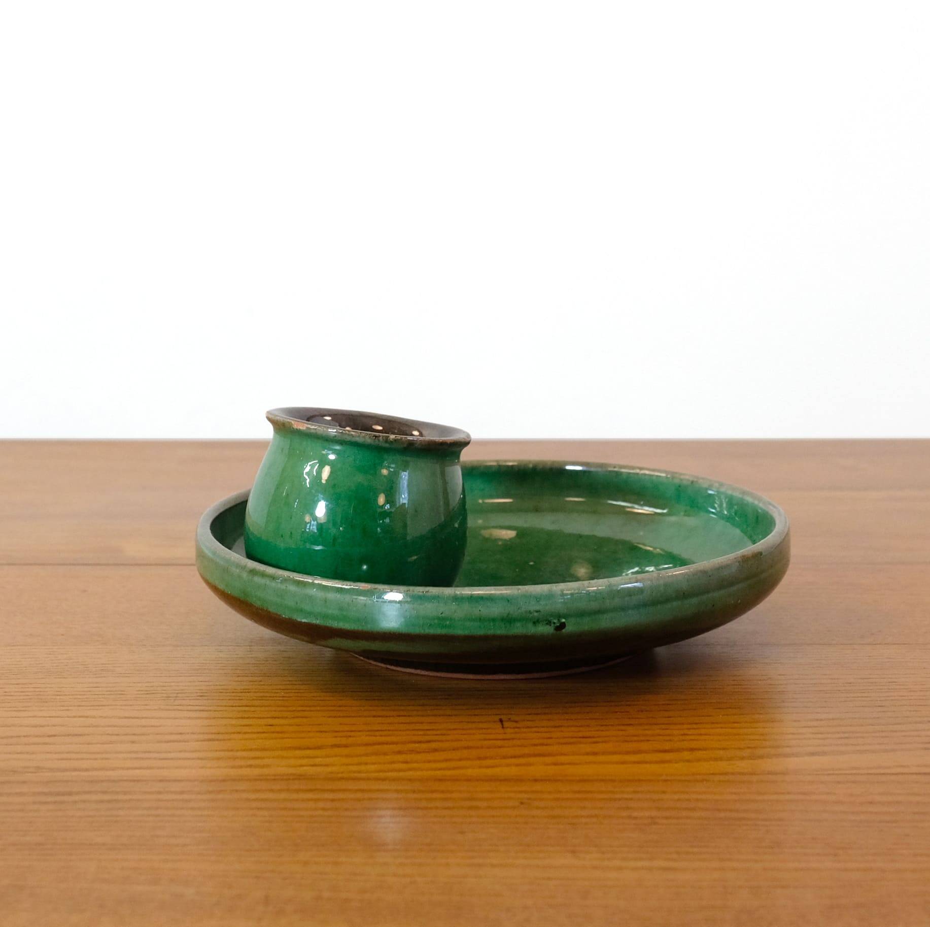 Glazed green earthenware candlestick