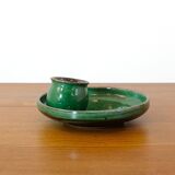 Glazed green earthenware candlestick