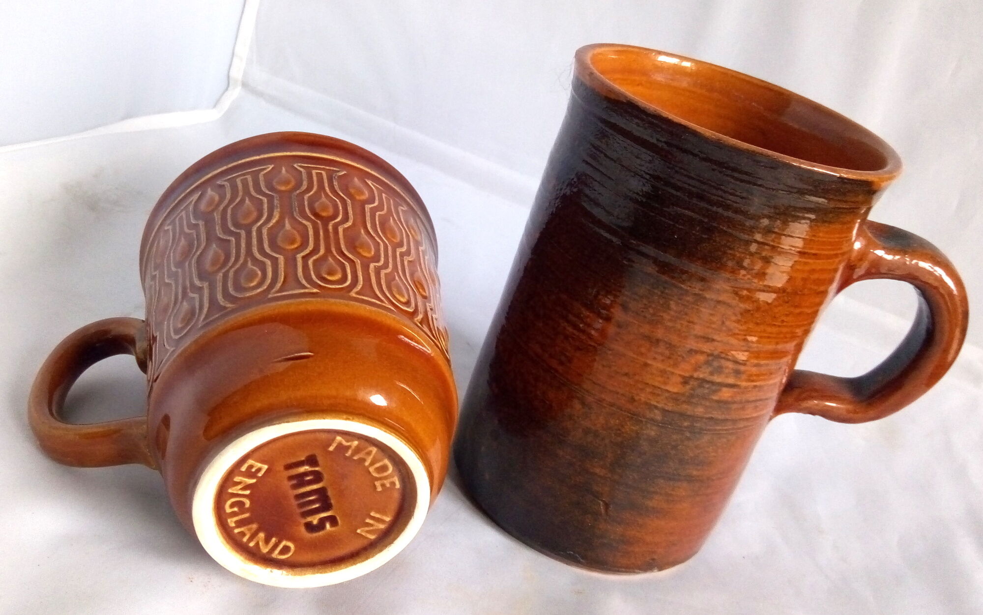 Duo of French-English brown and terracotta cups
