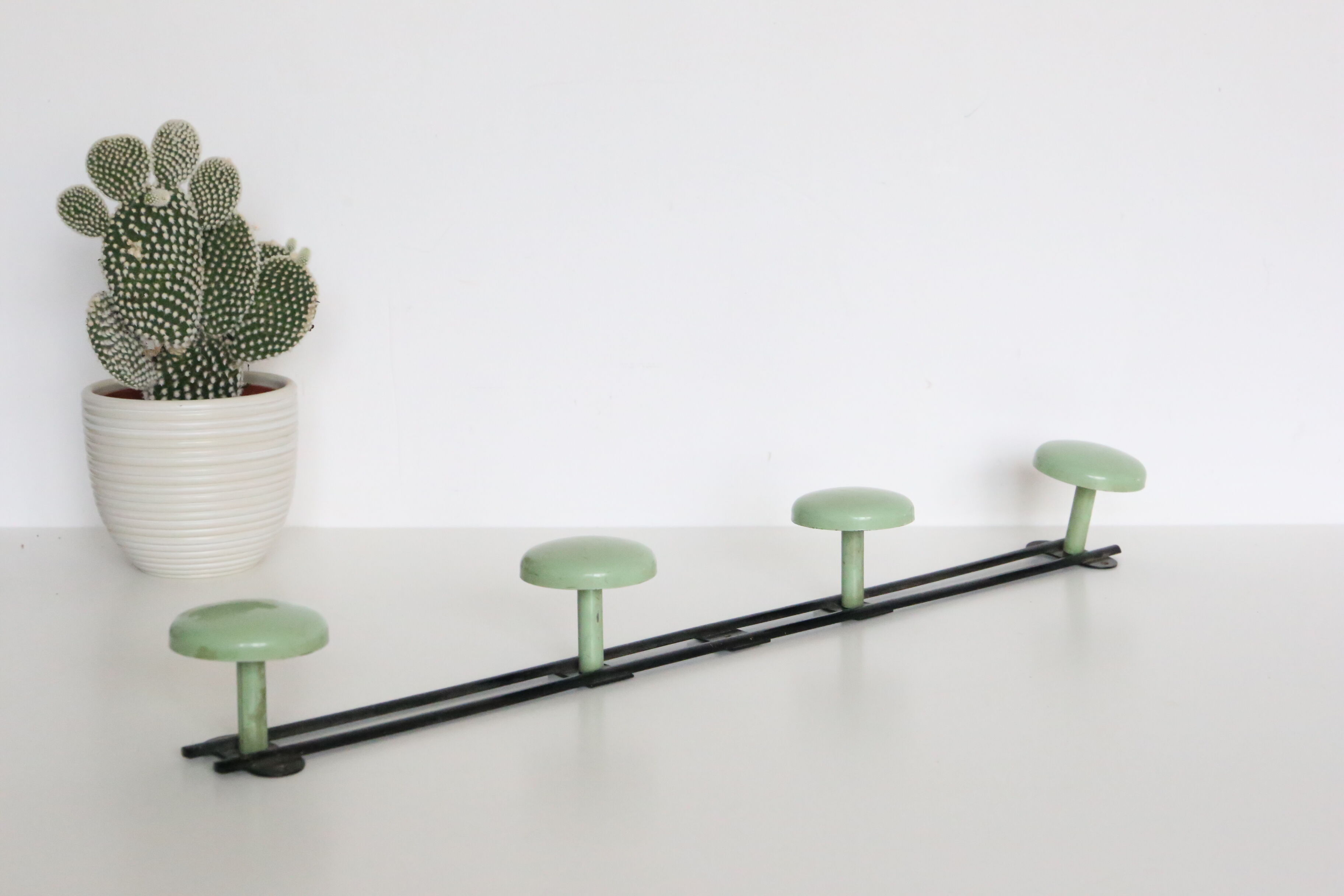 Metal, green and black, vintage wall coat holder