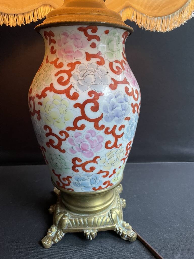 Old Asian vase mounted as a lamp with pagoda lampshade