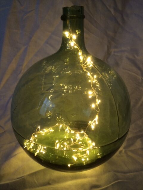 Demijohn old transparent green, estimated capacity around 12 to 15L