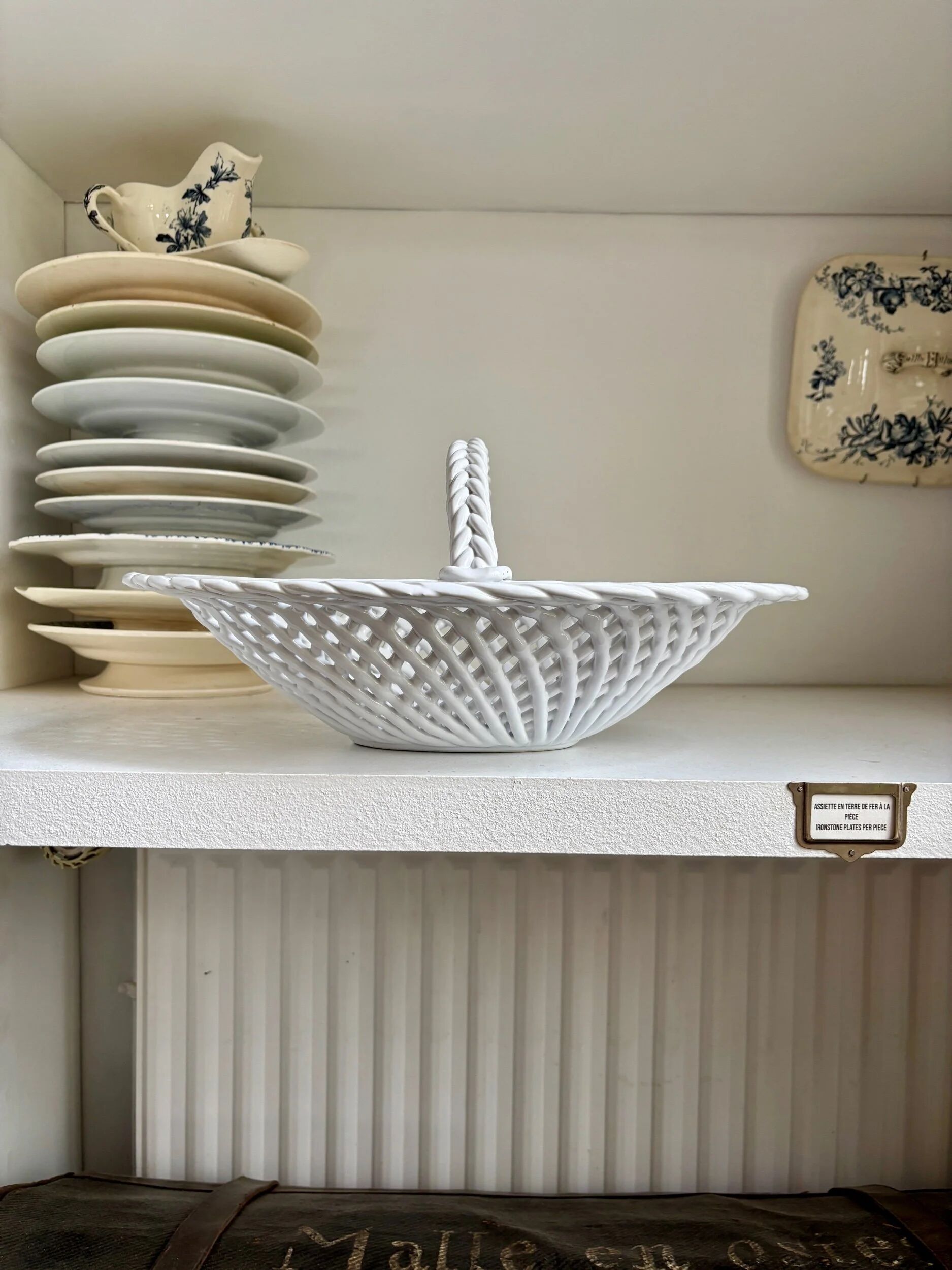 Oval basket in white glazed earthenware
