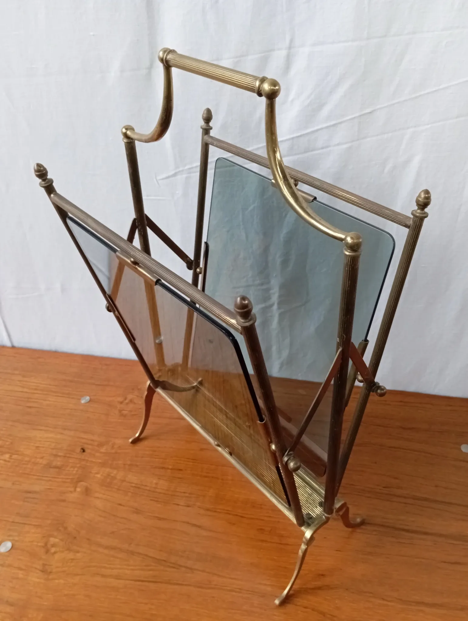 Neo-classical brass magazine rack in the spirit of Maison Jansen.