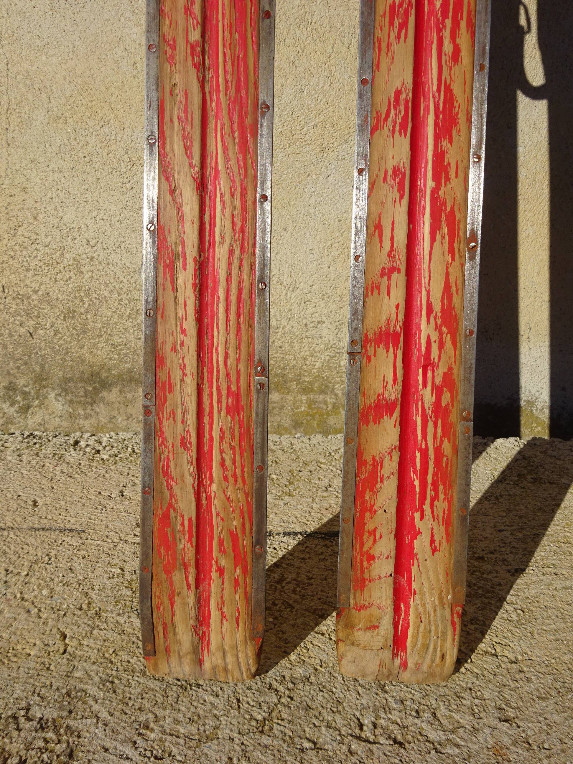 Pair of old wooden skis and metal bindings altiere