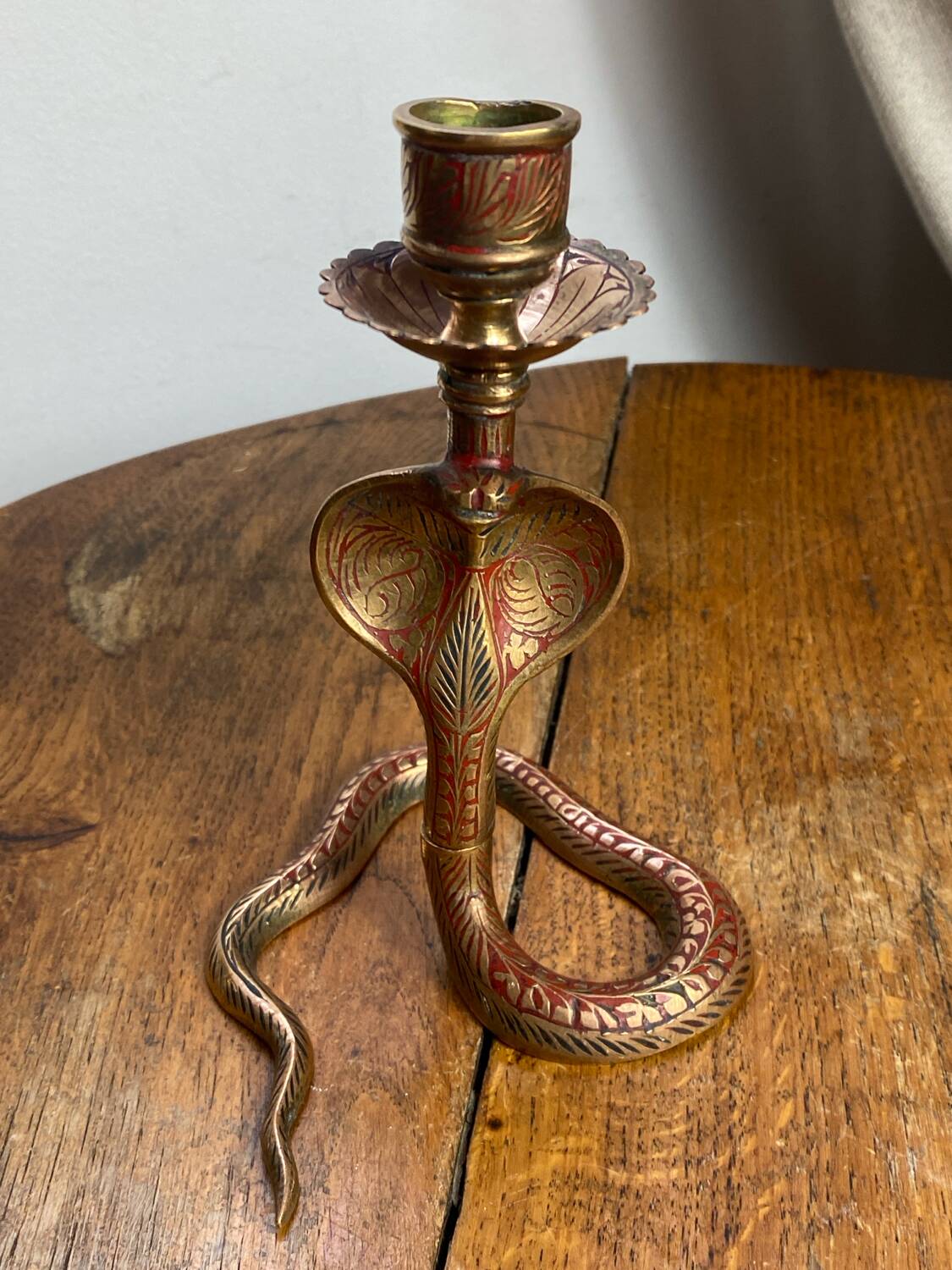 Chiseled brass cobra candlestick