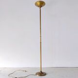 Halogen floor lamp in golden brass