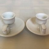 Pair of small white cellar rat candlesticks