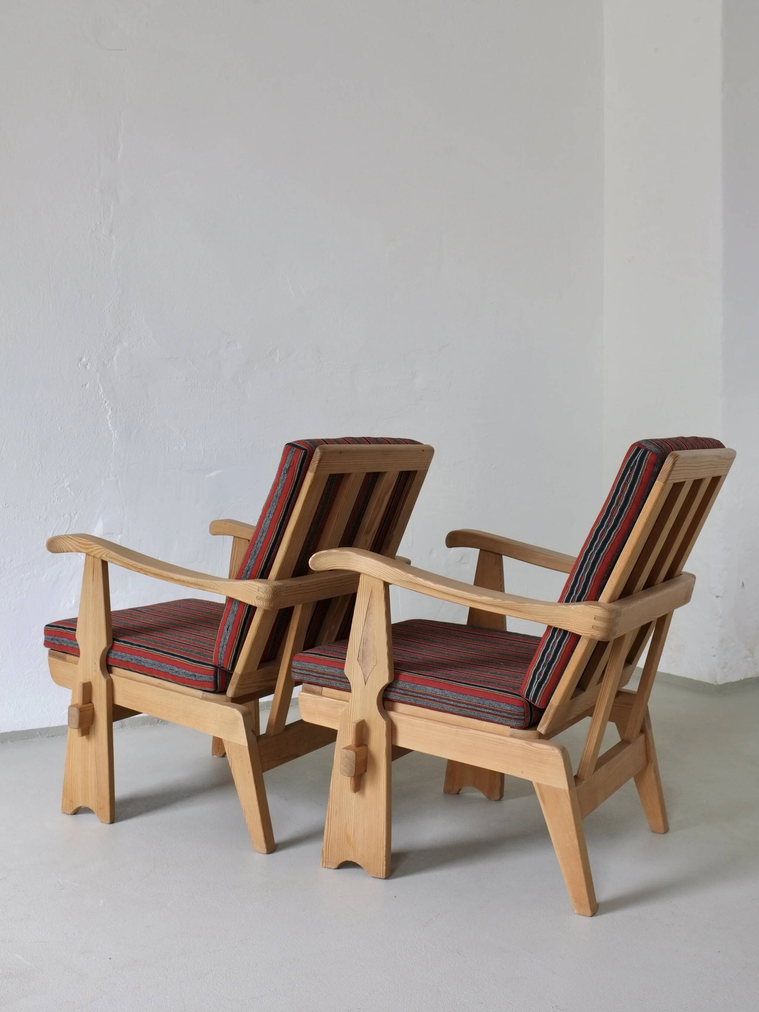 2 carved pine lounge chairs | Scandinavia | 1970s