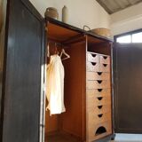 Old black wardrobe - wooden drawers and labels of origin