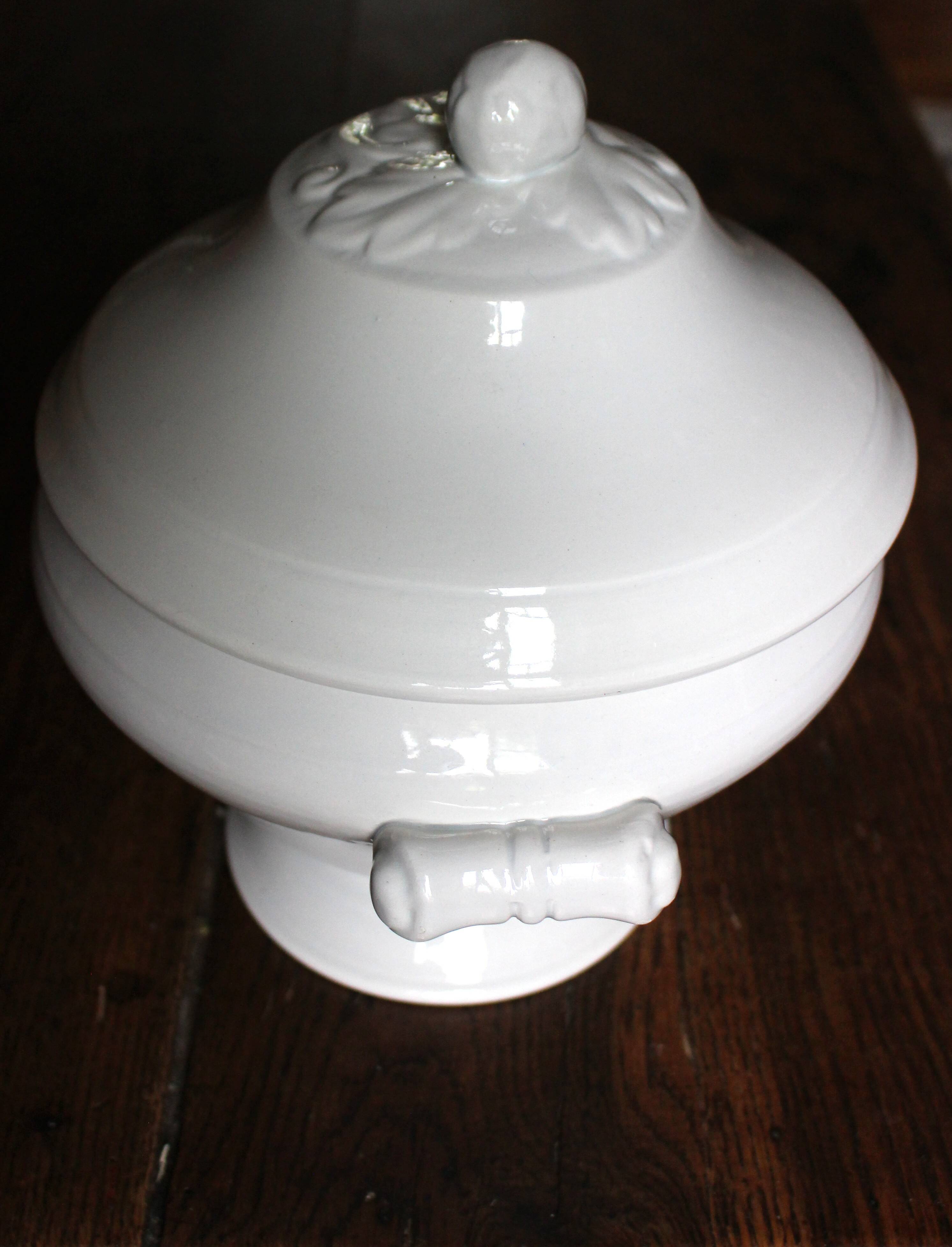Antique soup tureen, white earthenware, with stopper decoration.
