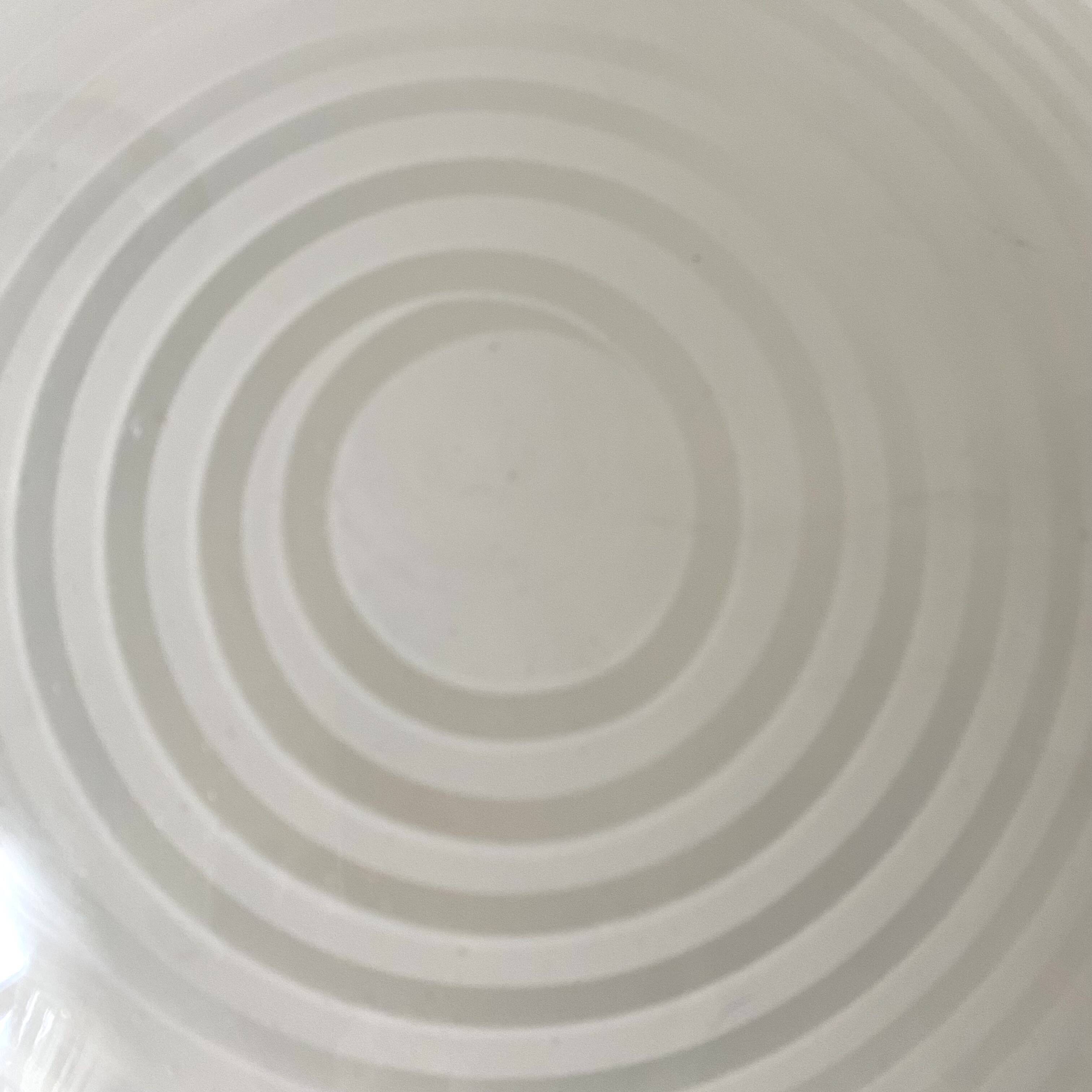 Round curved spiral ceiling light space age