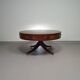 Table basse / table tambour victorienne « Heldense » en acajou avec plateau en cuir sur roulettes en laiton. Années 1980