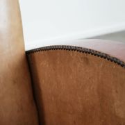 Art Deco design armchair in light cognac cowhide leather.