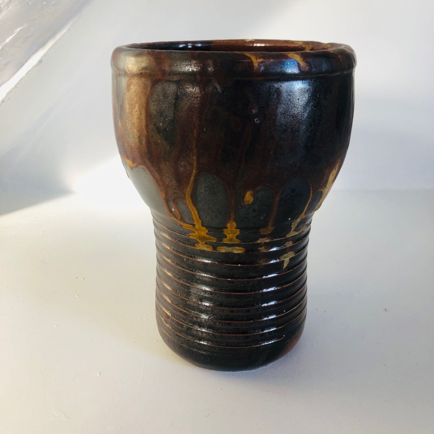 Metallic brown ceramic torso vase