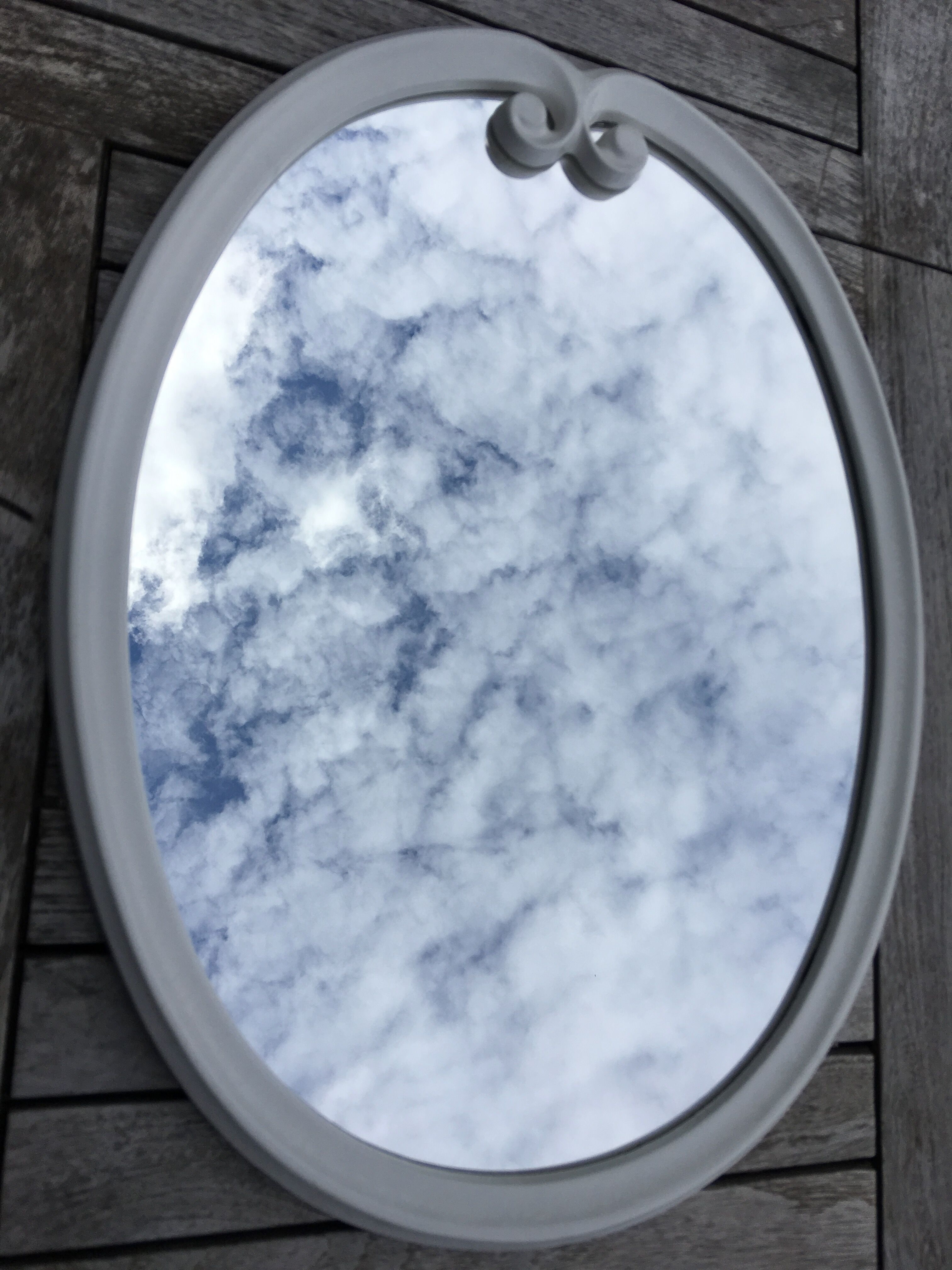 Oval mirror enamelled cast iron and its hook, circa 1950 39x49cm