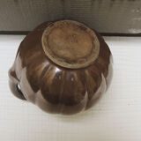 Old pitcher in glazed brown ceramic