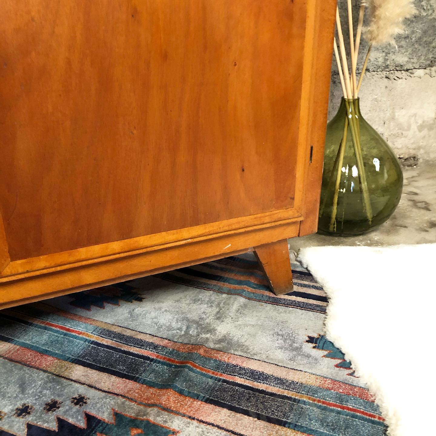 Vintage wooden cabinet with compass feet