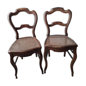 Louis XV style chairs in wood and cane.