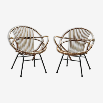 Pair of rattan shell chairs with metallic feet