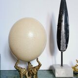 Ancient ostrich egg naturalized on bronze base representing 3 elephants