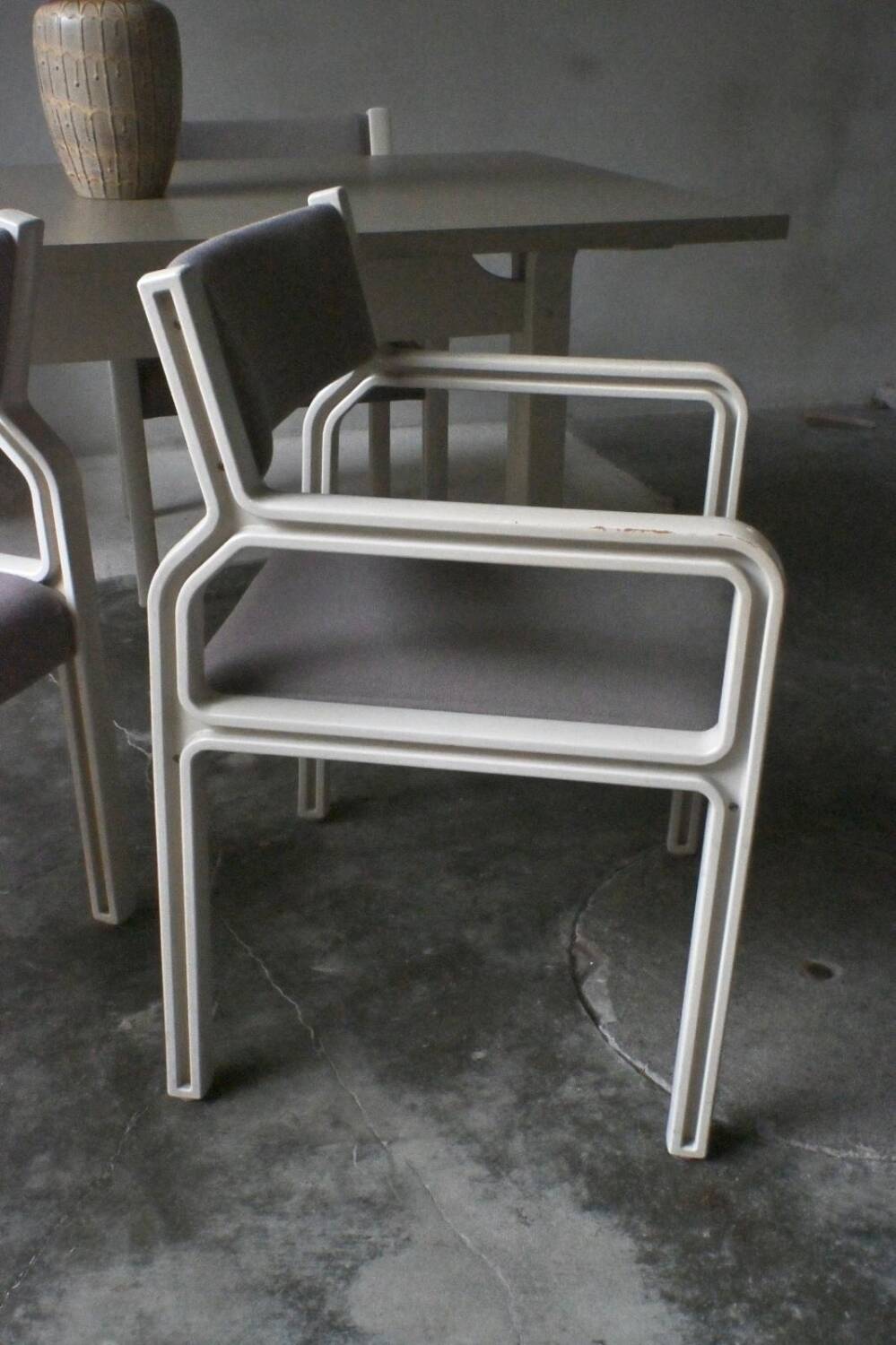 Dining table set and 4 dining chairs by Pierre Mennen for Pastoe.