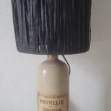 Lamp bottle in gres lampshade in black raffia