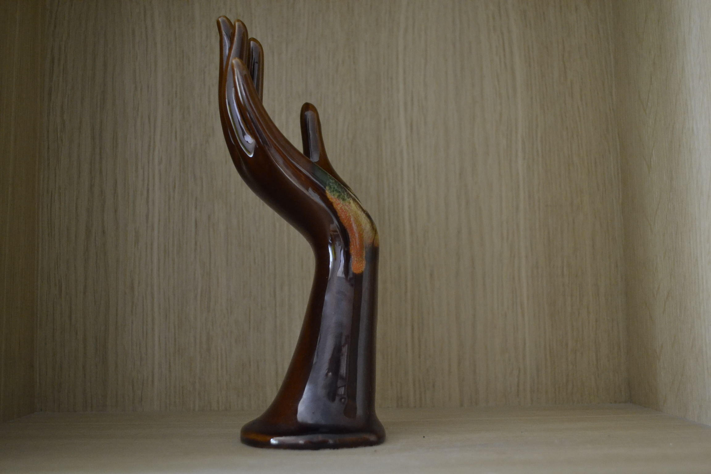 Brown and green baguier hand