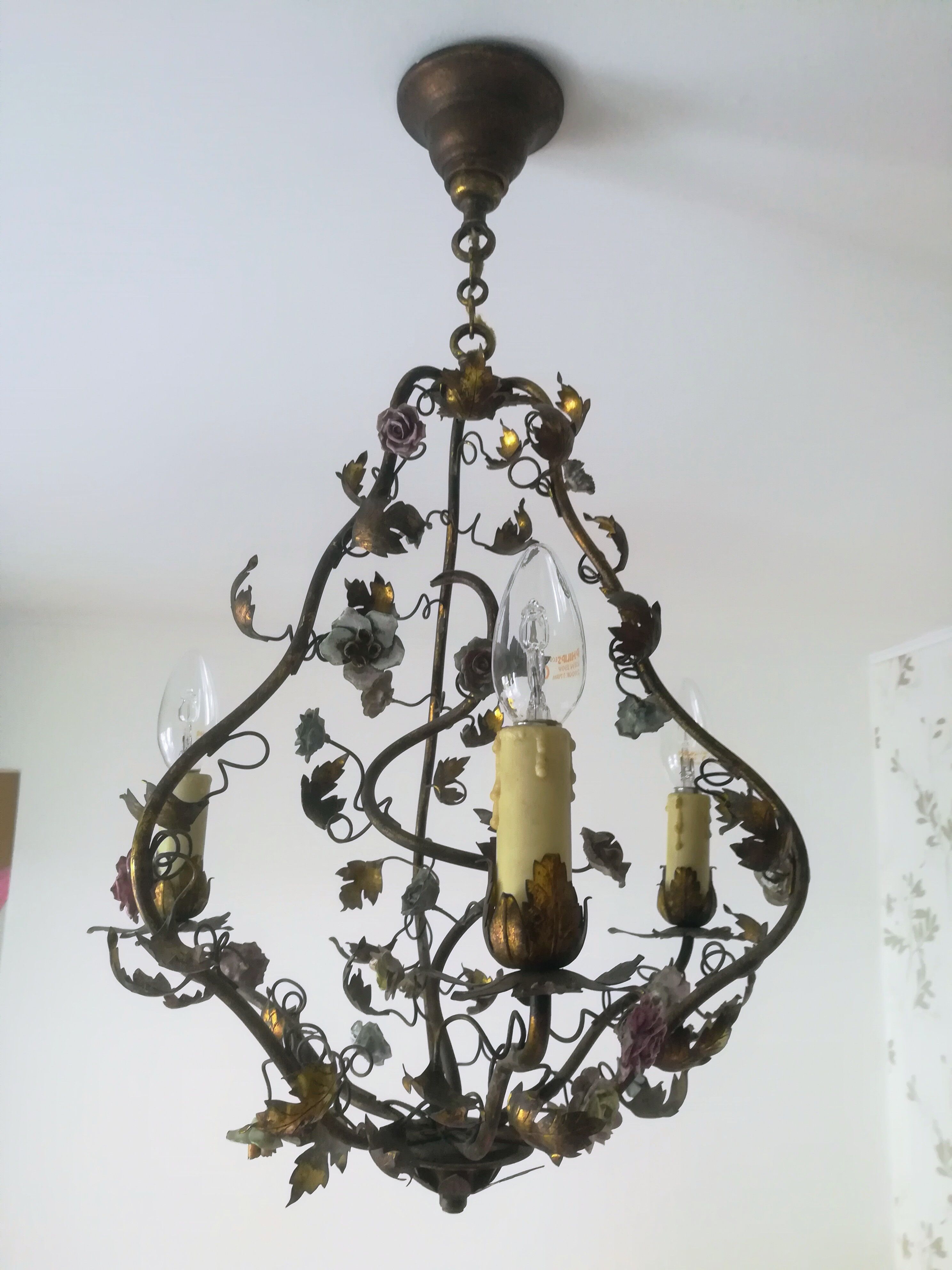 Brass chandelier and porcelain flowers