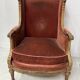 Two Louis XVI style wing chairs in gilded wood, 20th century