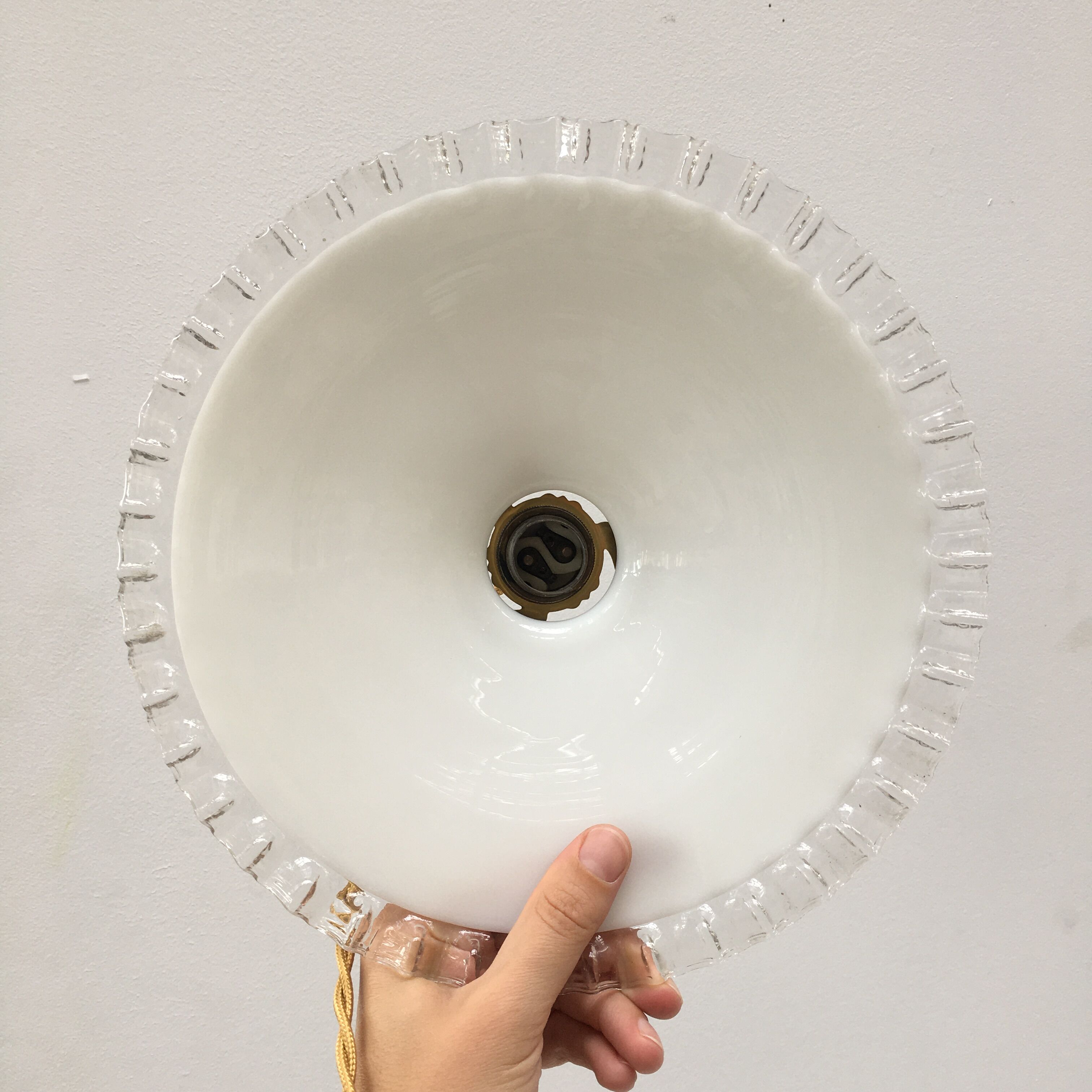 Pair of white opaline suspensions with serrated edges