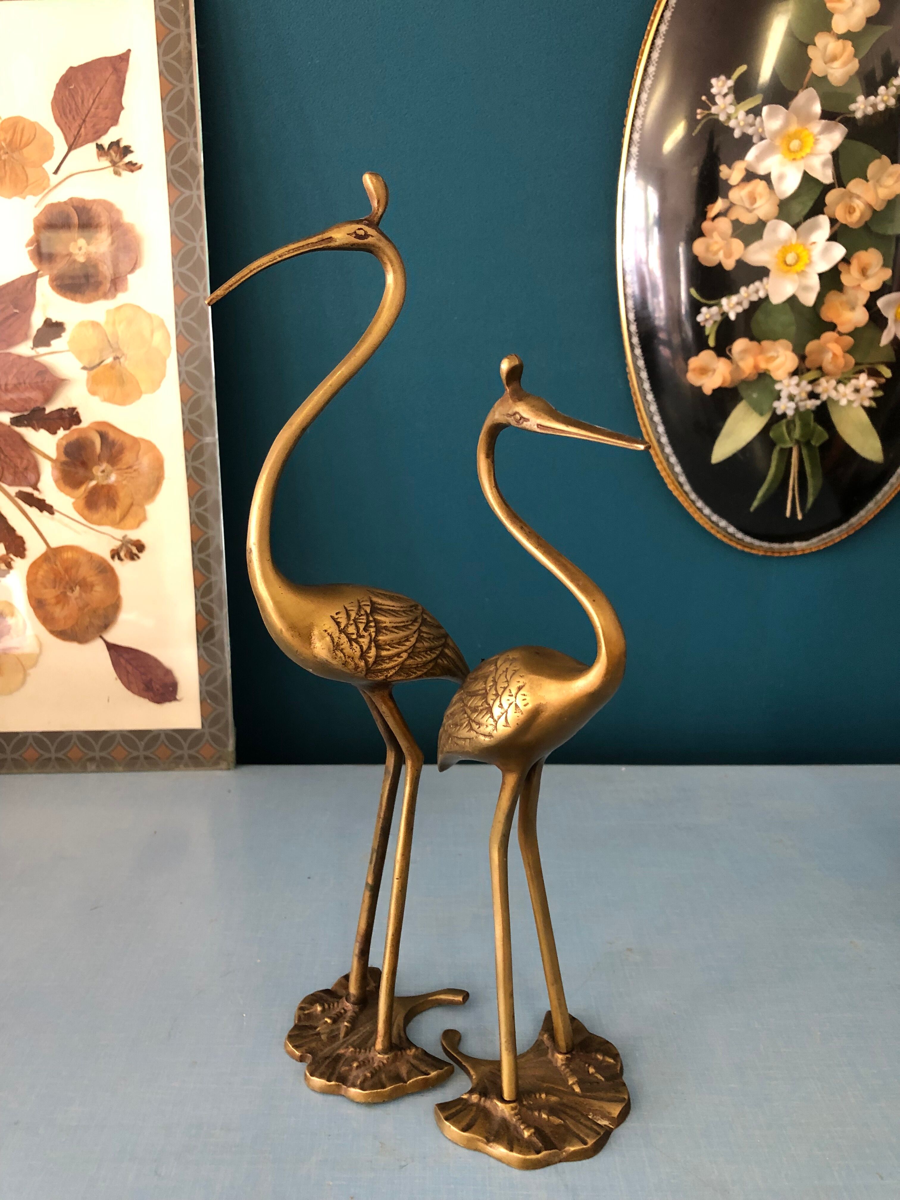Couple of brass herons
