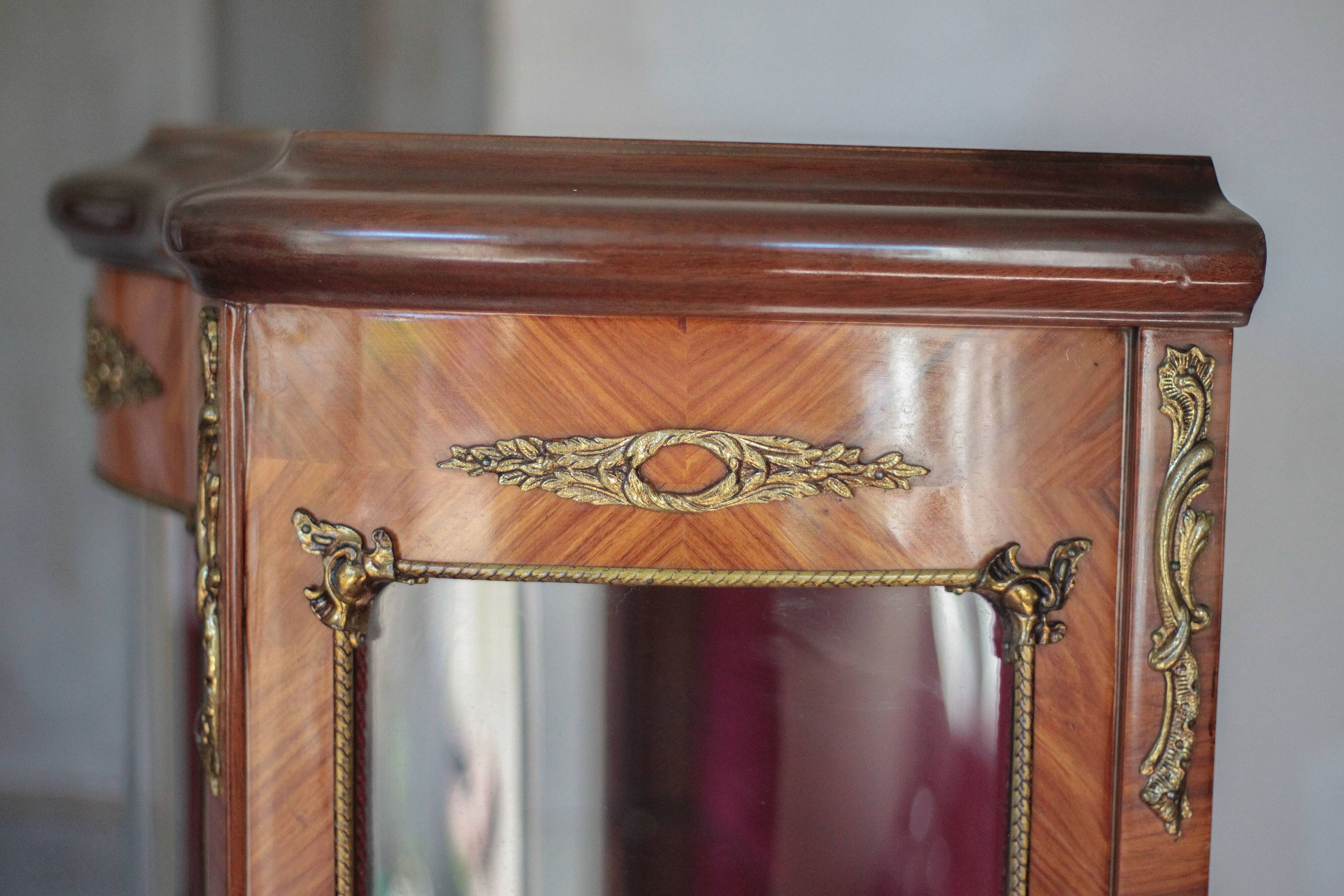 Marquetry display cabinet, curved Louis XV style, signed Marquant