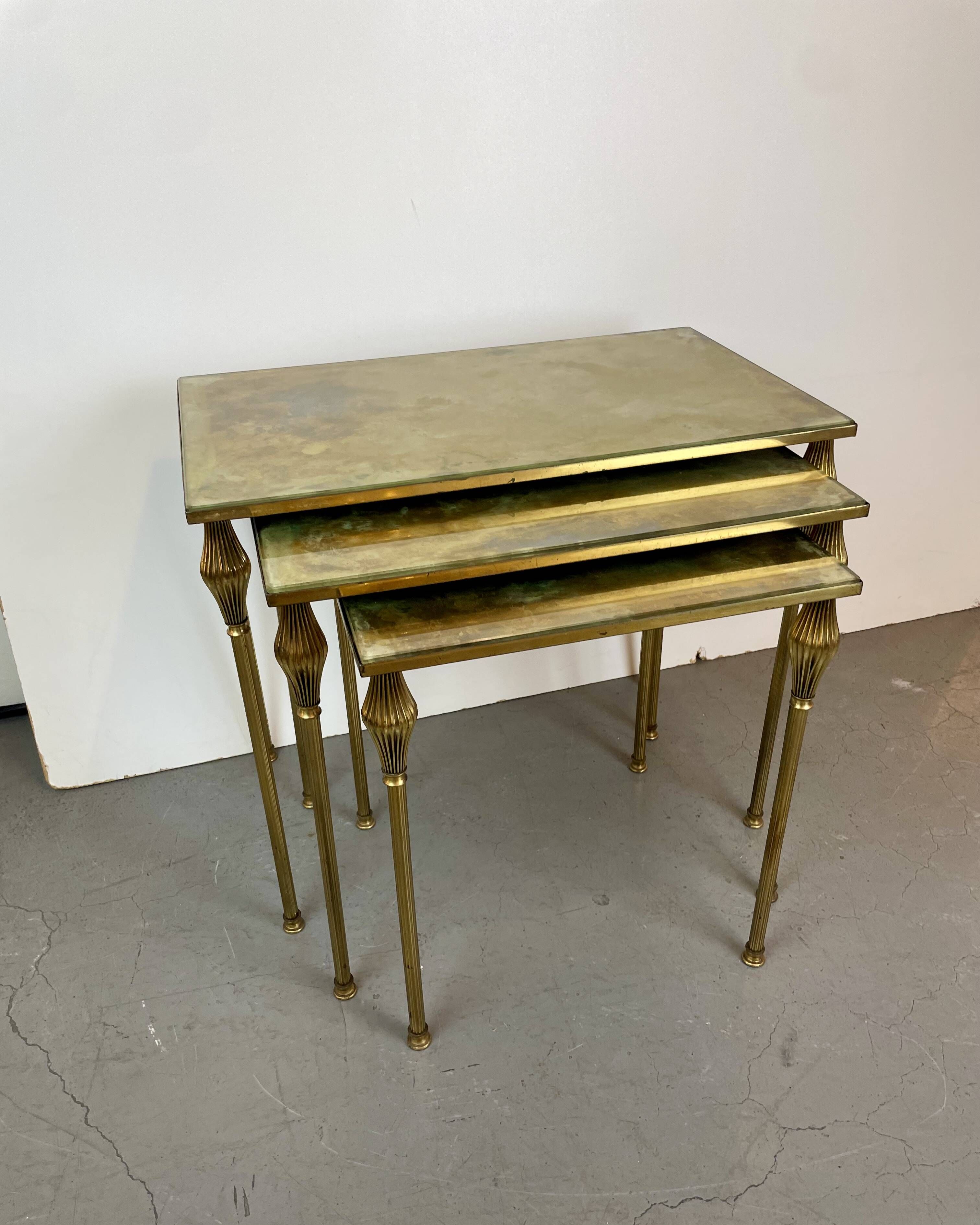 Nested brass tables, attributed to Maison Baguès, France, 1950–60.