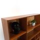 Deens teak vakkenkast met lades en hoge poten, vintage wandkast