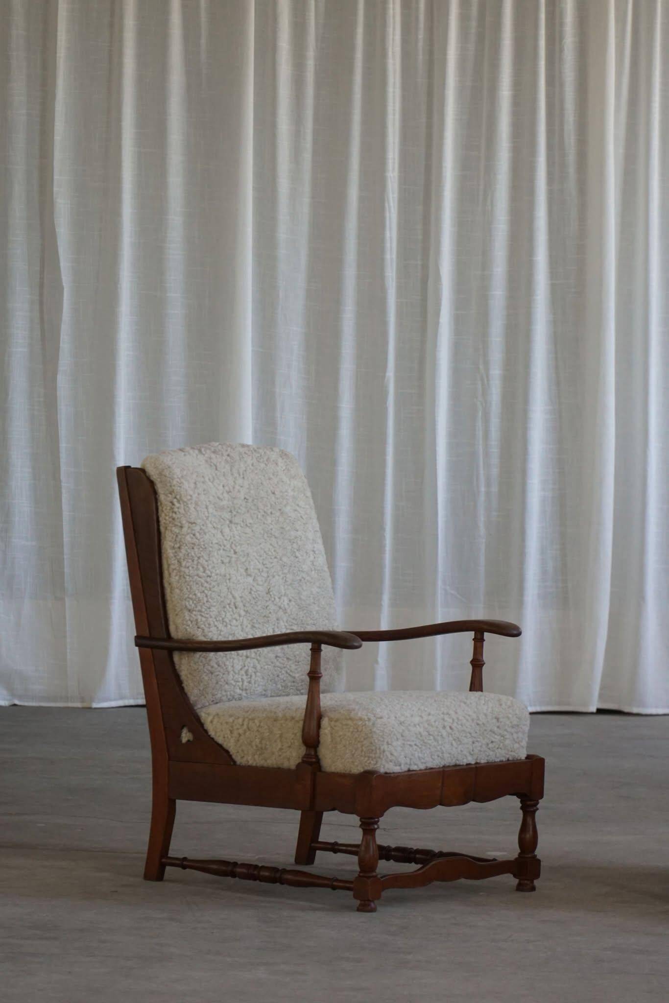 Modern Danish design, a pair of high-backed armchairs in oak and lambswool, 1950s.