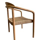 Solid wood chair with woven seat and armrests