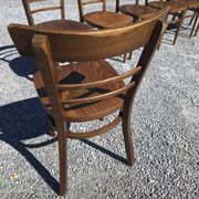 7 curved wooden bistro chairs by Baumann
