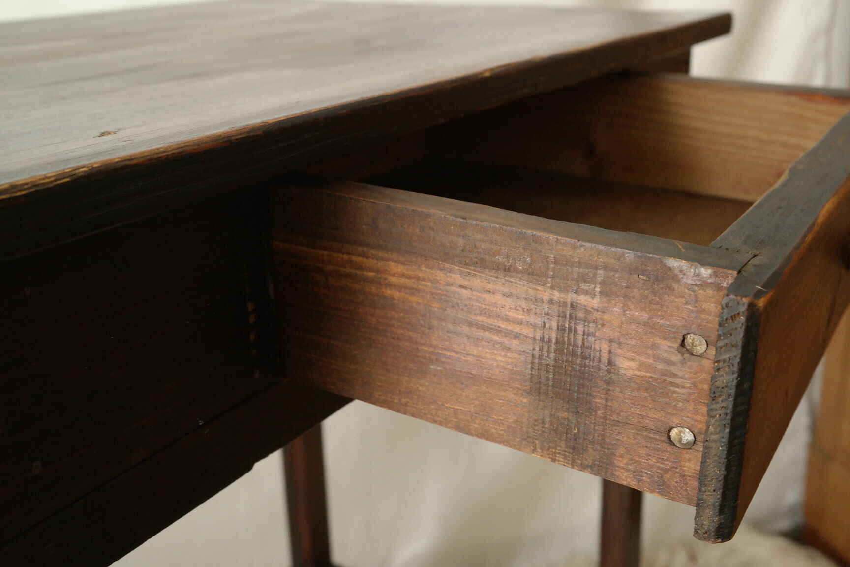 Old country side table in waxed wood