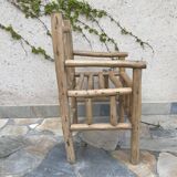 Art-Populaire armchair in raw wood, circa 1950.