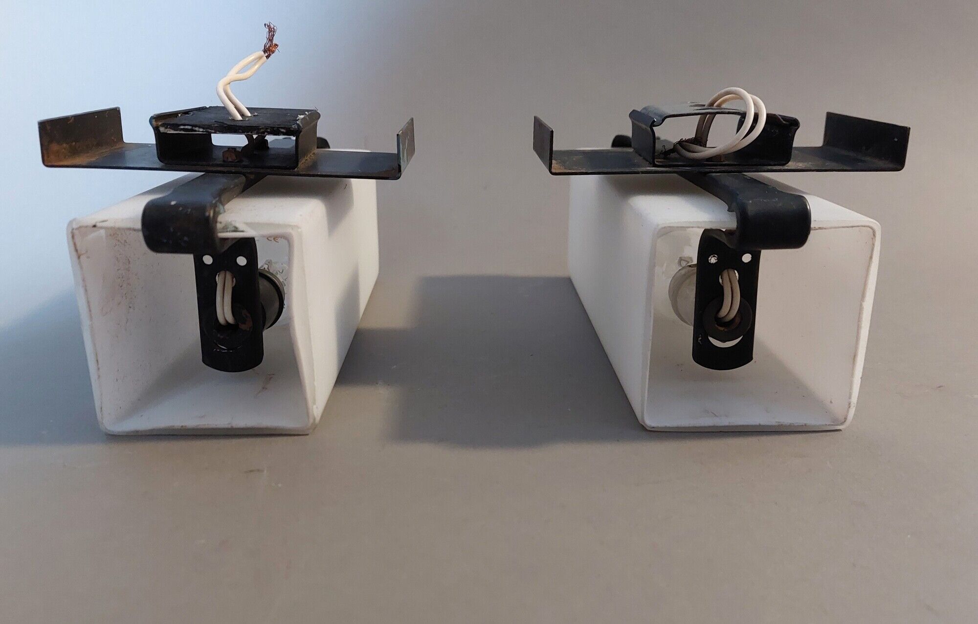 Pair of modernist sconces in black metal and white opaline vintage